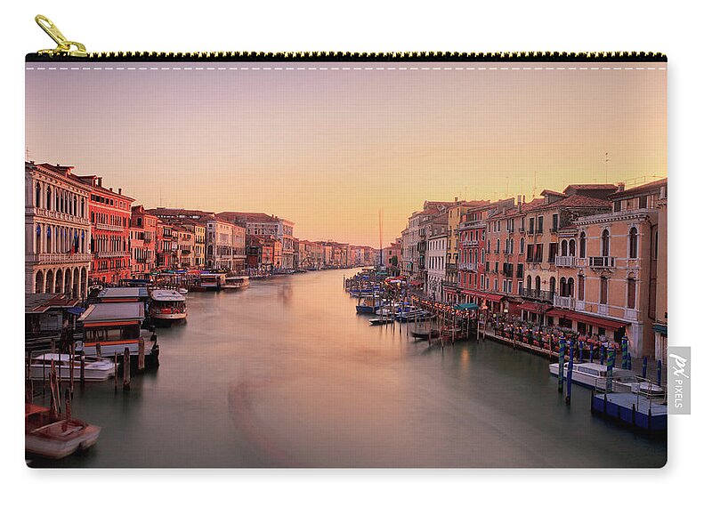 Blurred Motion Zip Pouch featuring the photograph Evening Glow by John And Tina Reid