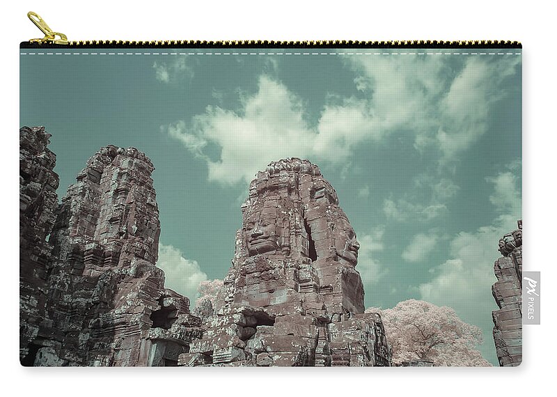 Ancient Zip Pouch featuring the photograph Faces of Bayon Temple in infrared by Karen Foley
