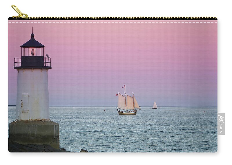 Fame Zip Pouch featuring the photograph Fame at Sunset on Salem Harbor by Jeff Folger
