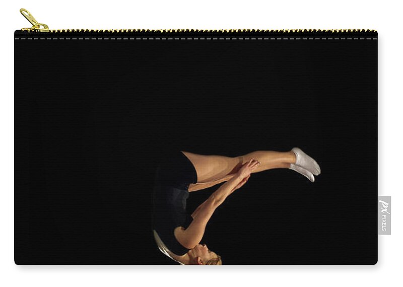 People Zip Pouch featuring the photograph Female Gymnast Upside Down Mid Flight by Peter Muller