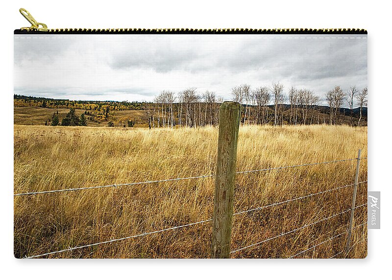 Fence Post And Speckled Hills Zip Pouch featuring the photograph Fence Post and Speckled Hills by Tom Cochran