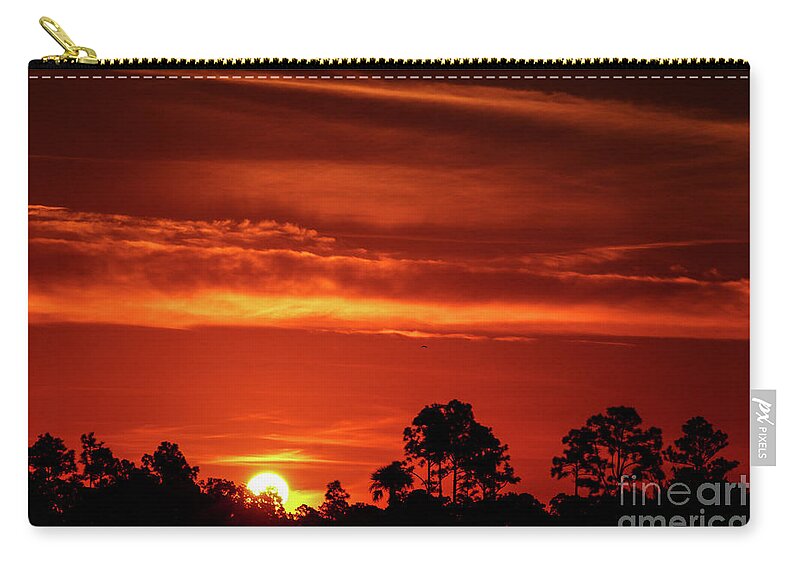 Sun Zip Pouch featuring the photograph Fiery Pine Glades Sunrise by Tom Claud