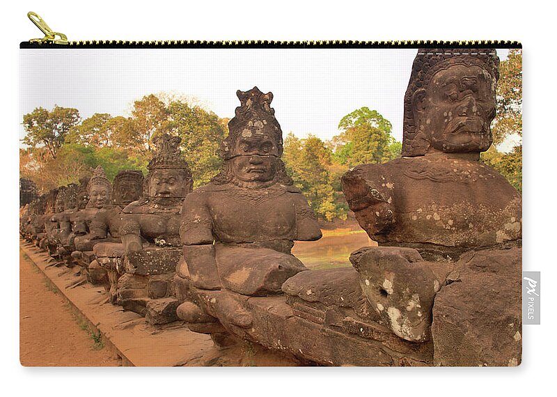 The End Zip Pouch featuring the photograph Fifty Four Asuras Along Causeway To by Jim Simmen