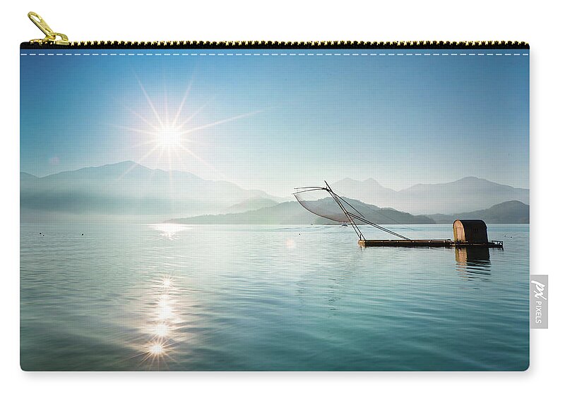 Tranquility Zip Pouch featuring the photograph Fishing Boat At Sunrise by Wan Ru Chen