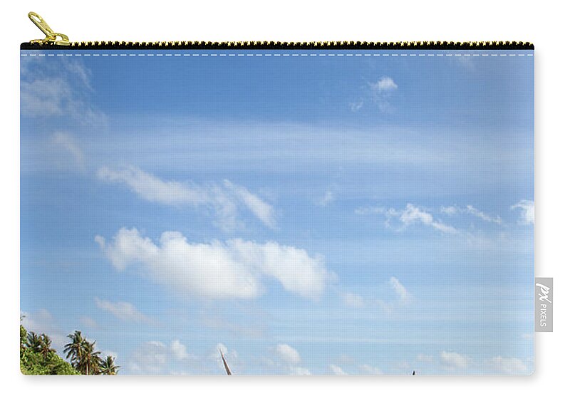 Tranquility Zip Pouch featuring the photograph Fishing Dhows Moored By The Beach by Matthew Scholey