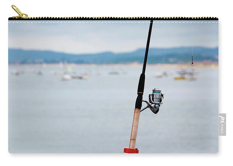 Outdoors Zip Pouch featuring the photograph Fishing Rod by Sebastian Condrea