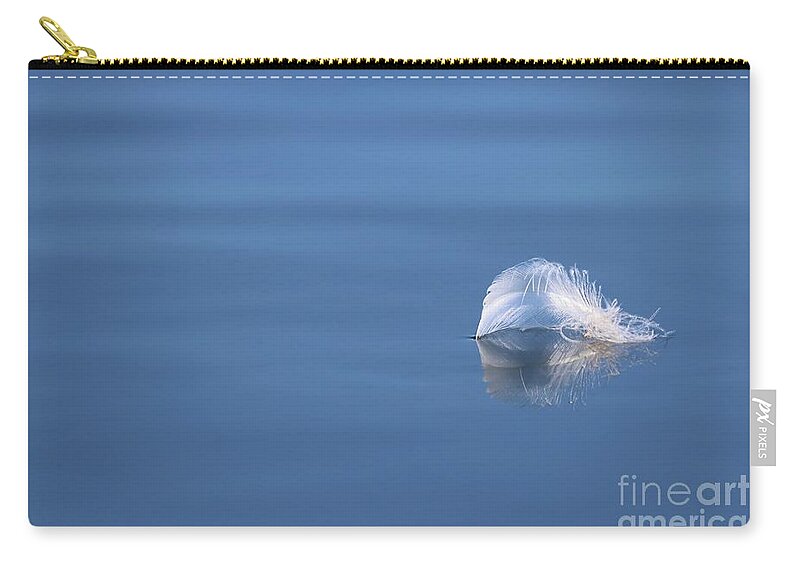 Minimalism Zip Pouch featuring the photograph Floating White Delicate Feather by Sandra Huston