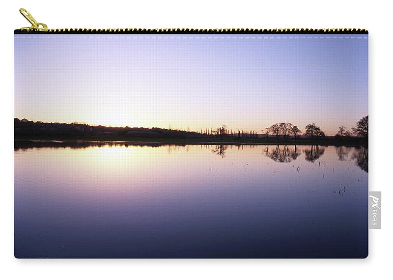 Water Meadow Zip Pouch featuring the photograph Flooded Water Meadow at sunset by Nicholas Henfrey