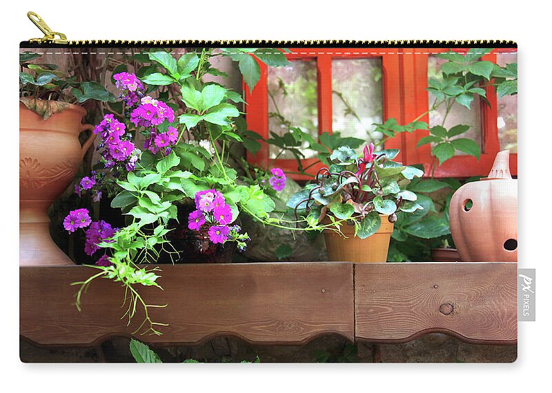 Flowerbed Zip Pouch featuring the photograph Garden by Imagedepotpro