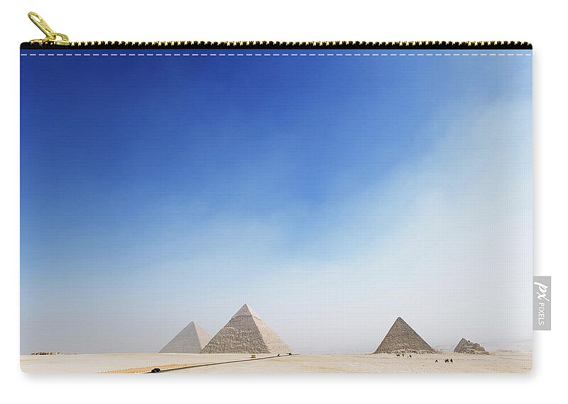 Clear Sky Carry-all Pouch featuring the photograph Giza Pyramids by Roine Magnusson