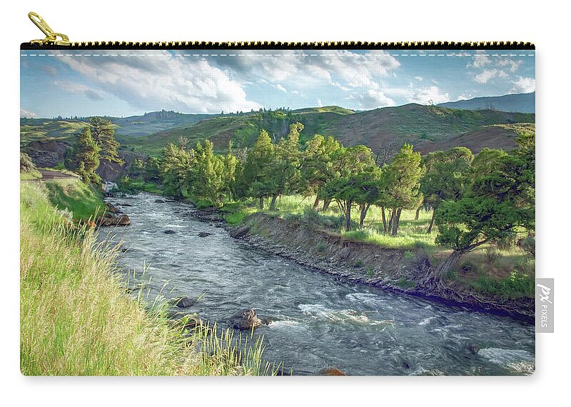 Yellowstone National Park Zip Pouch featuring the photograph Golden Light Along the Yellowstone River by Marcy Wielfaert