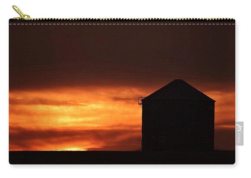 Grain Bin Sunset Zip Pouch featuring the photograph Grain Bin Sunset by Kathy M Krause