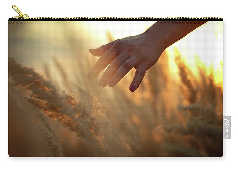 Farm Worker Zip Pouch featuring the photograph Hand In A Field by Aleksandarnakic