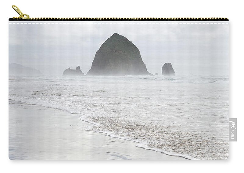 Haystack Rock Zip Pouch featuring the photograph Haystack Rock by Tim Newton