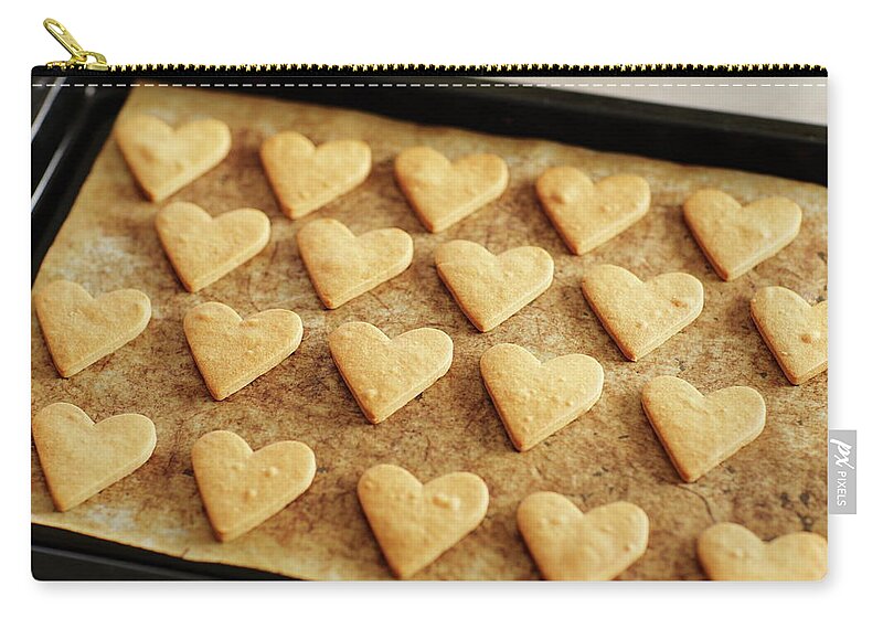 In A Row Zip Pouch featuring the photograph Heart Cookies On Oven Tray by Sot