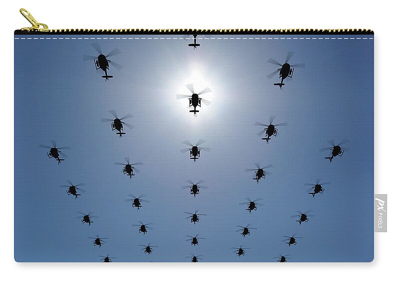 Expertise Zip Pouch featuring the photograph Helicopter Silhouette In The Sky by Georgo