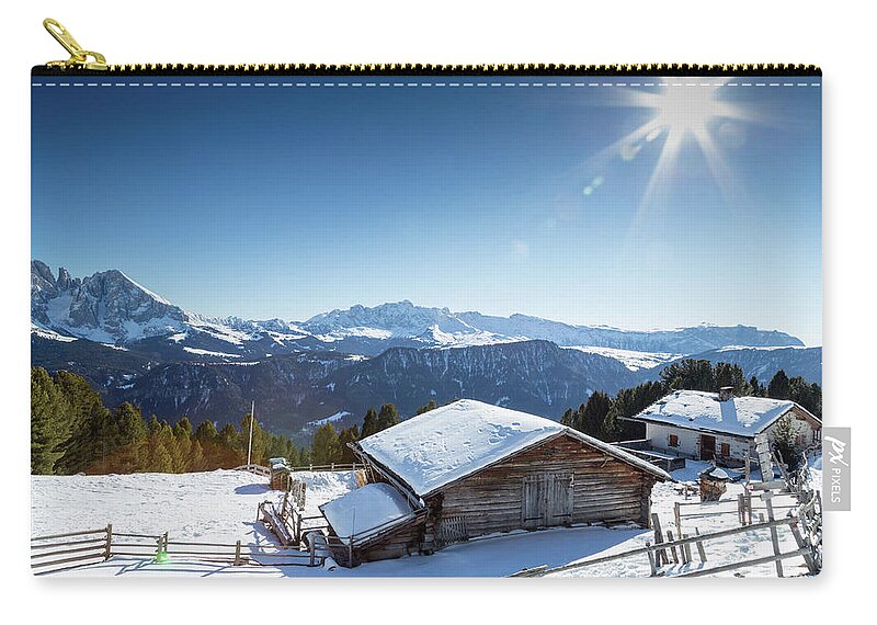 Alpine Zip Pouch featuring the photograph High-altitude mountain hut in front of a panorama of snow-capped by Vivida Photo PC