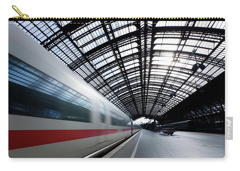 North Rhine Westphalia Carry-all Pouch featuring the photograph High Speed Train In Cologne Central by Jorg Greuel
