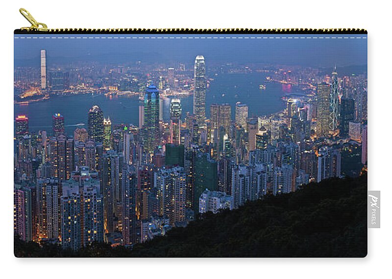 New Territories Zip Pouch featuring the photograph Hong Kong Skyscrapers Glittering Lights by Fotovoyager
