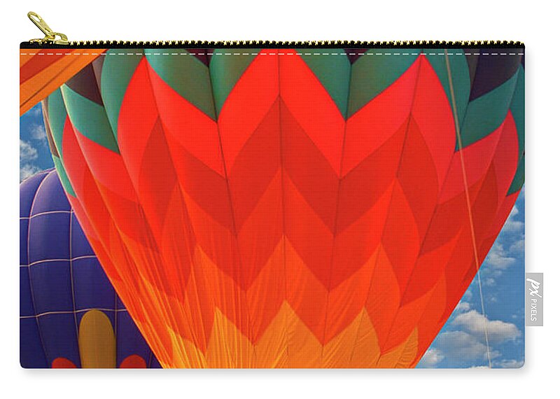 Up And Away Zip Pouch featuring the photograph Hot Air Balloons Vertical by David Zanzinger