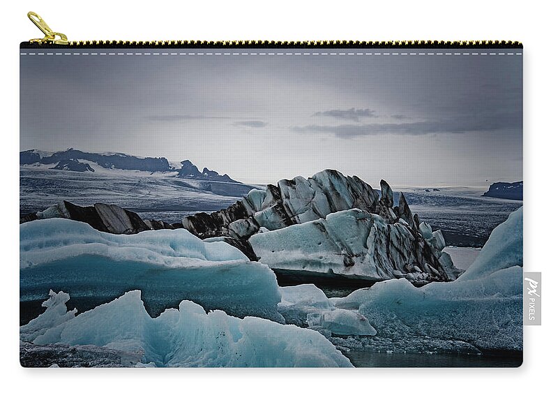 Iceland Zip Pouch featuring the photograph Icy Stegosaurus by Jim Cook