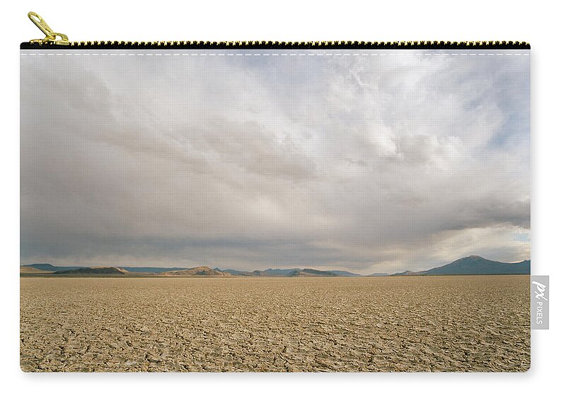 Scenics Zip Pouch featuring the photograph Idaho Desert, Dry Lake Bed With Clouds by Matthias Clamer