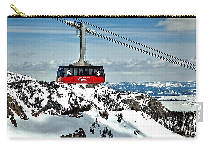 Jackson Hole Tram Zip Pouch featuring the photograph Jackson Hole Aerial Tram Over The Snow Caps by Adam Jewell