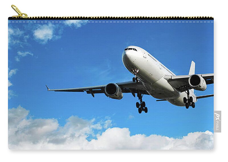 Taking Off Zip Pouch featuring the photograph Jet Airplane Landing In Bright Sky by Sharply done