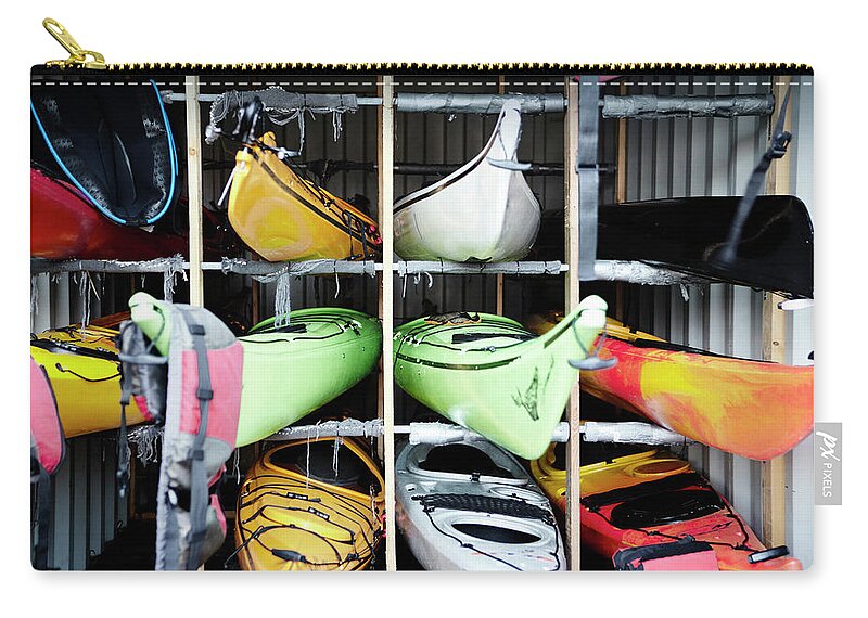 Copenhagen Zip Pouch featuring the photograph Kayaks Stacked In Cubes by Henrik Weis