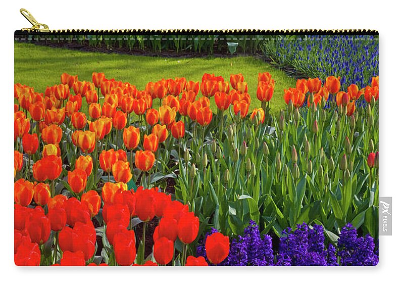 Flowerbed Zip Pouch featuring the photograph Keukenhof Gardens In Holland by Darrell Gulin