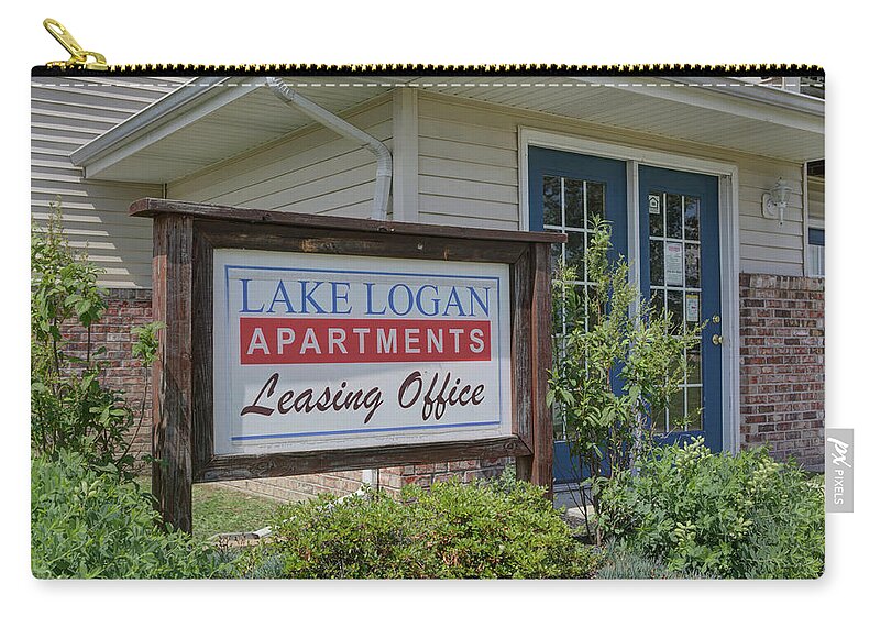 Sign Zip Pouch featuring the photograph Lake Logan apartments sign by Jeff Kurtz