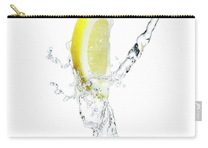 Purity Zip Pouch featuring the photograph Lemon Slice With A Splash Of Water by Chris Stein