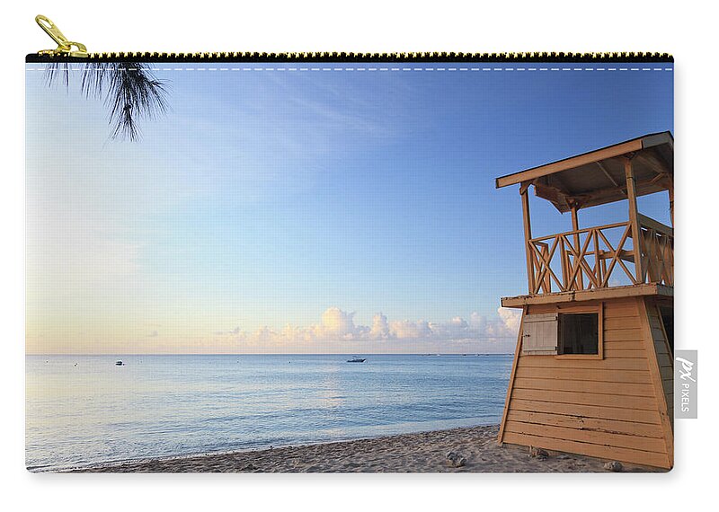 Tranquility Zip Pouch featuring the photograph Life Gaurd Hut On Holetown Beach by Michele Falzone