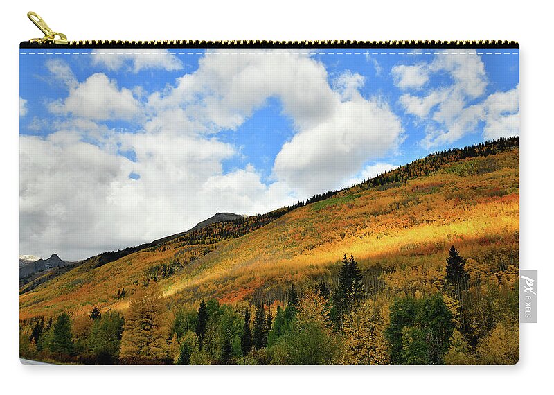 Red Mountain Pass Zip Pouch featuring the photograph Light Breaks Through onto Fall Colors by Ray Mathis