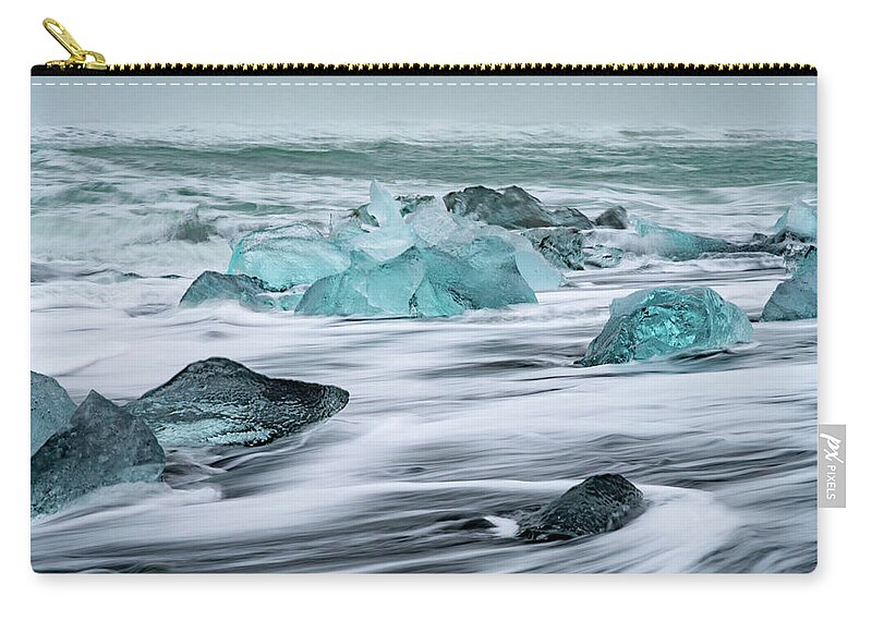 Iceland Zip Pouch featuring the photograph Long exposure at the Jokulsarlon ice beach by Mark Hunter