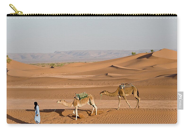 Scenics Zip Pouch featuring the photograph Man Walking Camels In Sand Dunes by Cultura Rm Exclusive/ben Pipe Photography