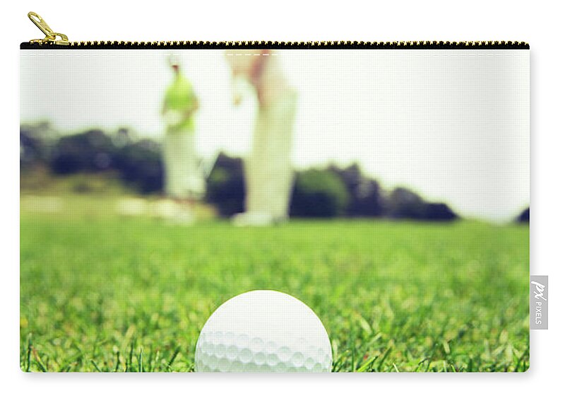 Tranquility Zip Pouch featuring the photograph Mature Couple Playing Golf by Bloom Image