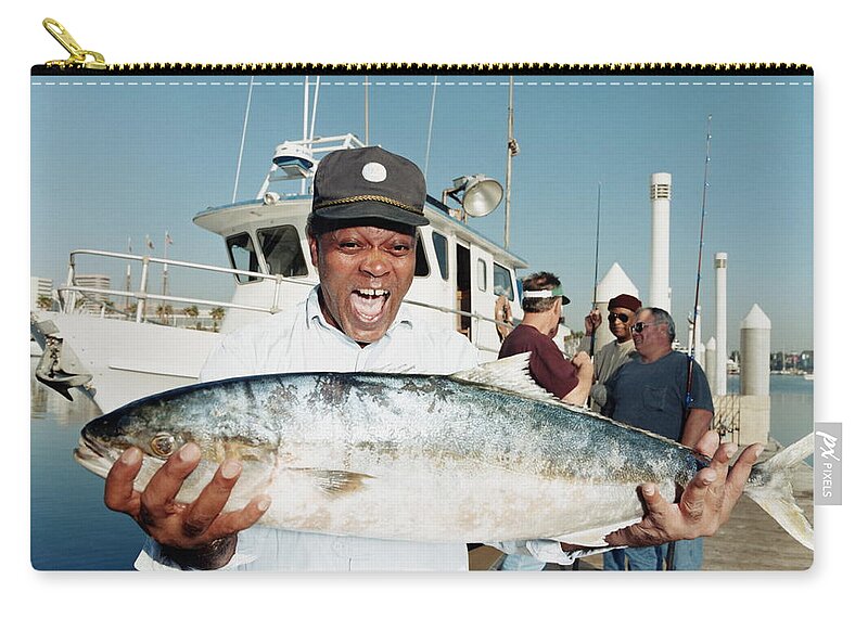 Baseball Cap Zip Pouch featuring the photograph Mature Man Holding Yellowtail Fish On by Sean Murphy