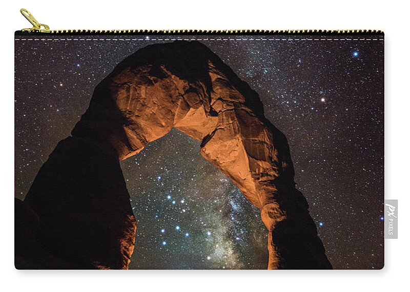 Tranquility Zip Pouch featuring the photograph Milky Way Illumination At Delicate Arch by Mike Berenson / Colorado Captures