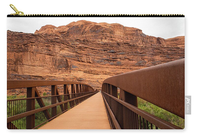 Moab Canyon Pathway Footbridge Zip Pouch featuring the photograph Moab Canyon Pathway Footbridge by Tom Cochran