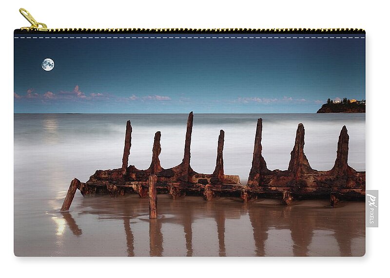 Scenics Zip Pouch featuring the photograph Moonrise Over The Wreck by Visionandimagination.com
