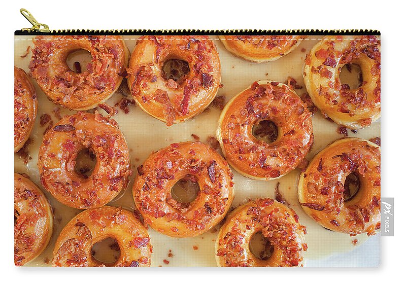 Unhealthy Eating Zip Pouch featuring the photograph Multiple Maple Glazed Bacon Donuts by Lisa Romerein