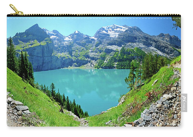 Scenics Zip Pouch featuring the photograph Oeschinen Mountain Lake by Werner Büchel