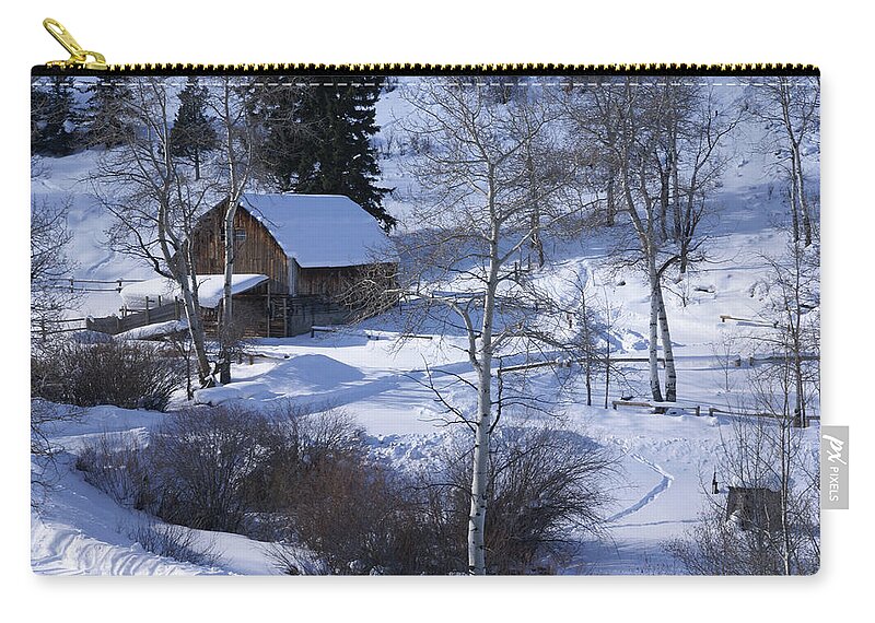 Snow Zip Pouch featuring the photograph Old western barn in snow with aspens by Steve Estvanik