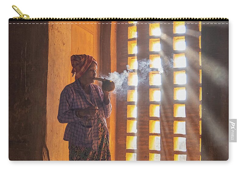 Woman Zip Pouch featuring the photograph older Burmese woman smoking a cigar by Ann Moore