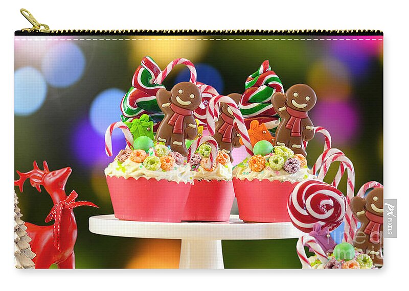 Christmas Zip Pouch featuring the photograph On trend candy land festive Christmas cupcakes. by Milleflore Images