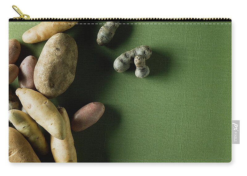 Sparse Zip Pouch featuring the photograph Organic Potatoes by Monica Rodriguez