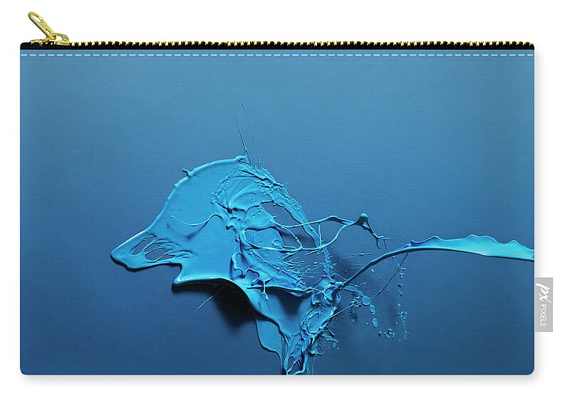 Copenhagen Zip Pouch featuring the photograph Paint Splashed On Blue Surface by Henrik Sorensen