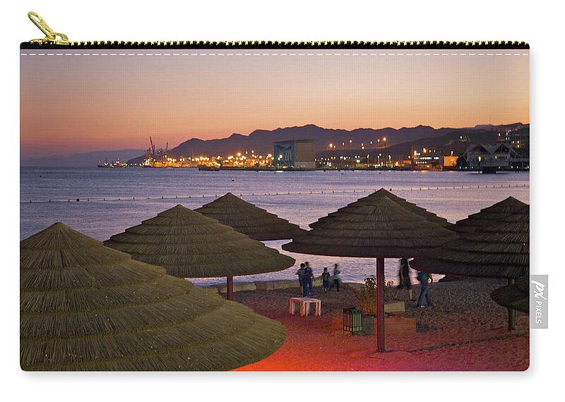 Tranquility Zip Pouch featuring the photograph People Moving Under Seaside Beach by Barry Winiker