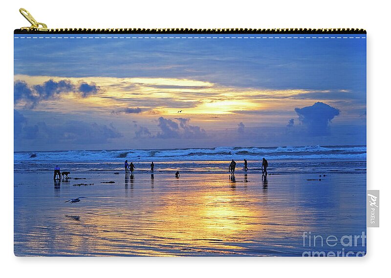People Zip Pouch featuring the photograph people recreation fun dog digging razor clams low tide ocean beach radiant blue gold sunset USA by Robert C Paulson Jr